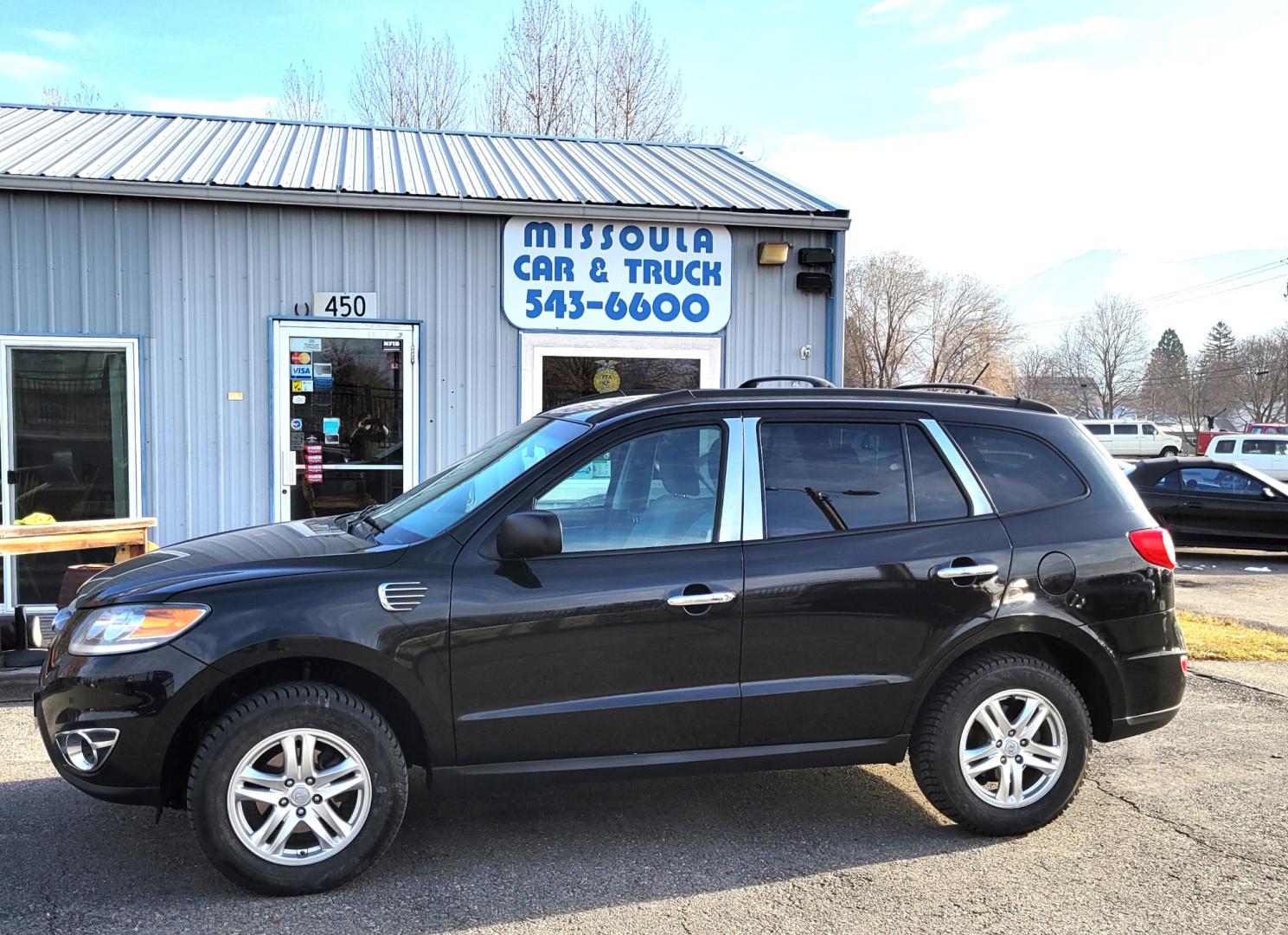 2012 Black /Tan Hyundai Santa Fe Premium (5XYZGDAB1CG) with an 2.4L I4 engine, 8 Speed Automatic transmission, located at 450 N Russell, Missoula, MT, 59801, (406) 543-6600, 46.874496, -114.017433 - Photo#2